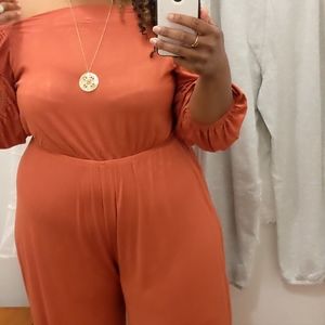Rust colored off shoulder jumpsuit